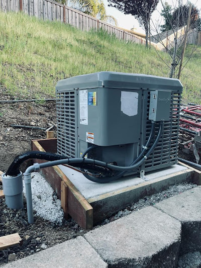 Standby generator beside a house