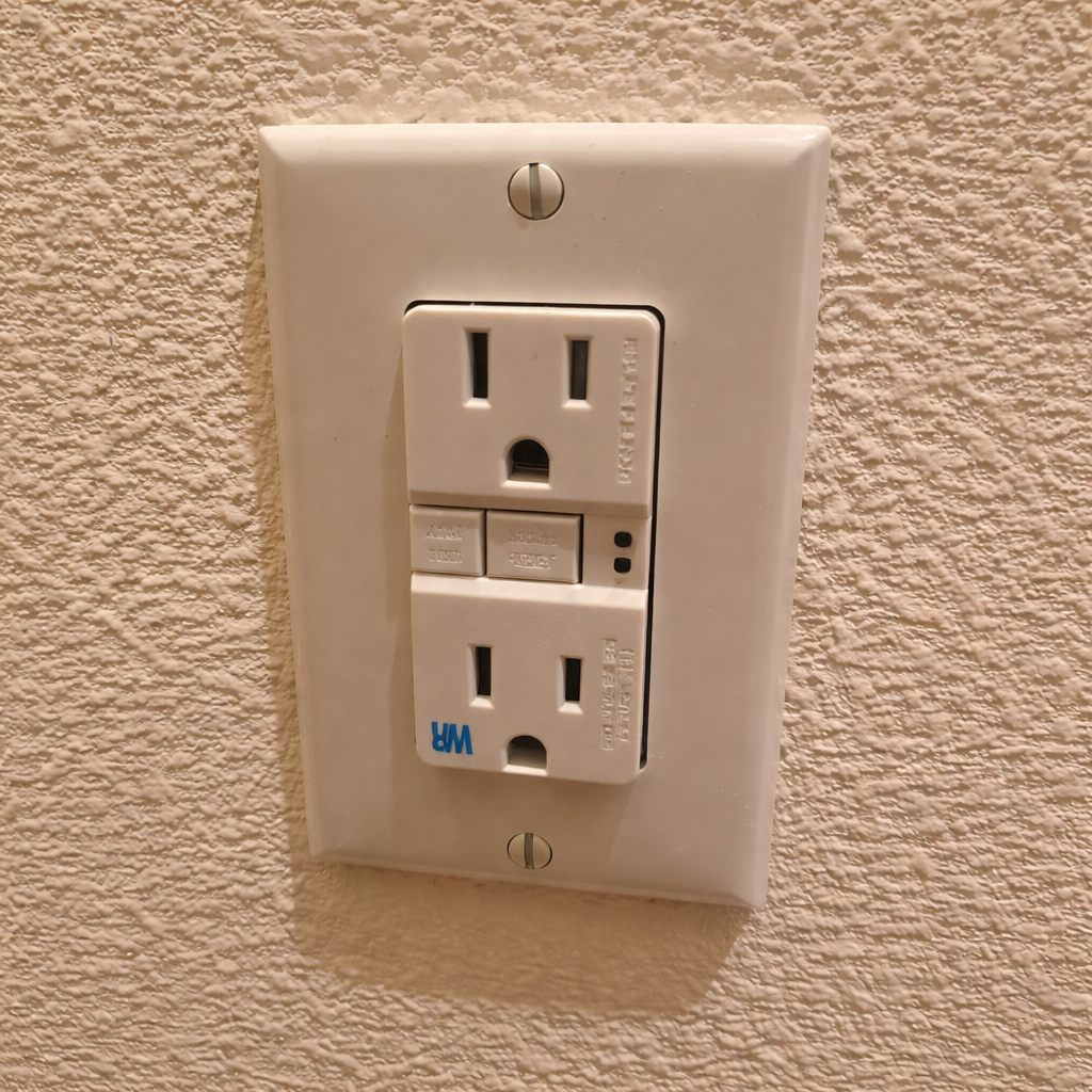 GFCI outlet on a textured wall
