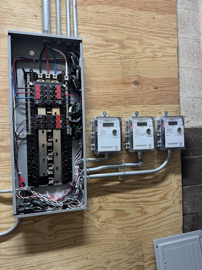 Licensed electrician working on electrical panel