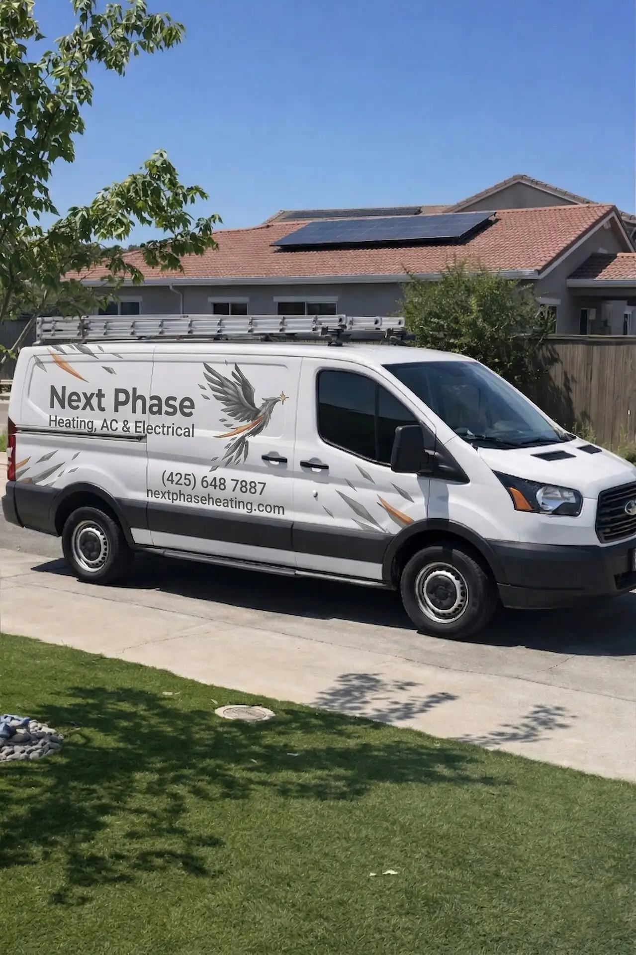 Next Phase service van parked in front of a house