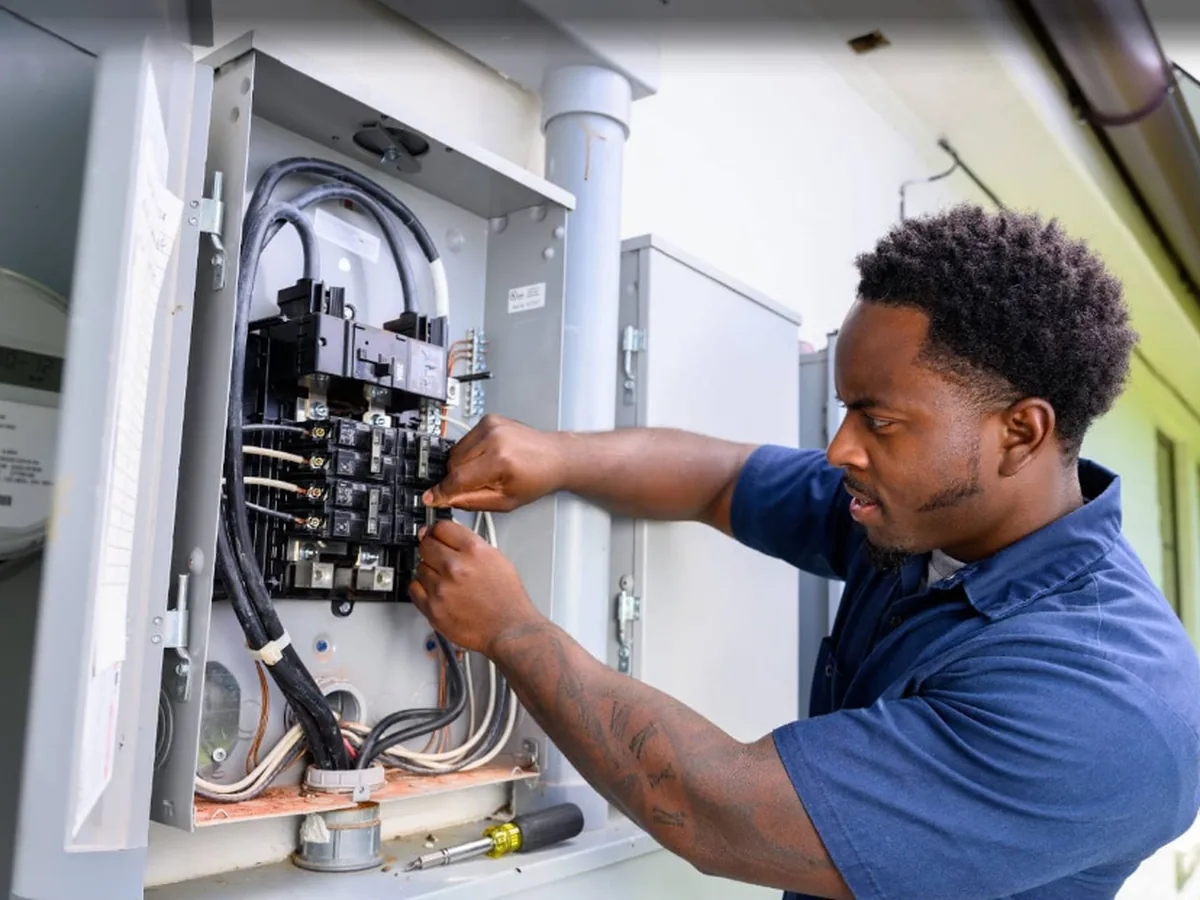 Next Phase electrician working on a home electrical panel